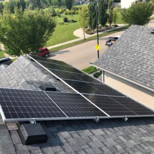 picture of a house with solar panels on the roof